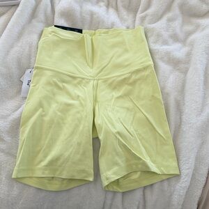 TNA butter cheeky 7” high rise bike shorts in limoncello